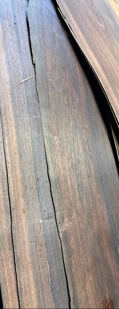 "Vintage 1950s Brazilian rosewood veneer pieces, 10 feet long by 6 to 10 inches wide, showing rich grain and figure"